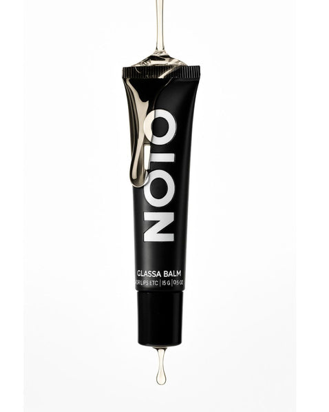 NOTO Botanics glassa balm, a lip oil, shown on white in still life